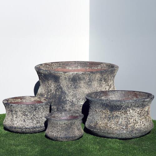 Pompeii Lotus Planter with black and white volcanic texture finish, shallow bowl-shaped ceramic planter with flared petal edges for indoor and outdoor use, available with Sydney and Canberra delivery