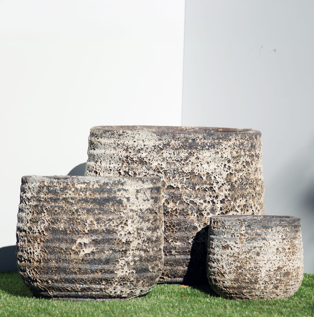 Pompeii Ribbed Planter with horizontal ribbing and black-and-white volcanic-style finish